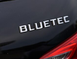 Mercedes BlueTEC diesel vehicle being refueled with AdBlue DEF fluid.