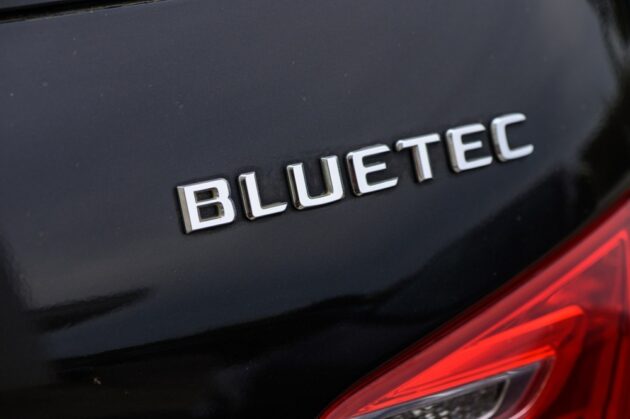 Mercedes BlueTEC diesel vehicle being refueled with AdBlue DEF fluid.