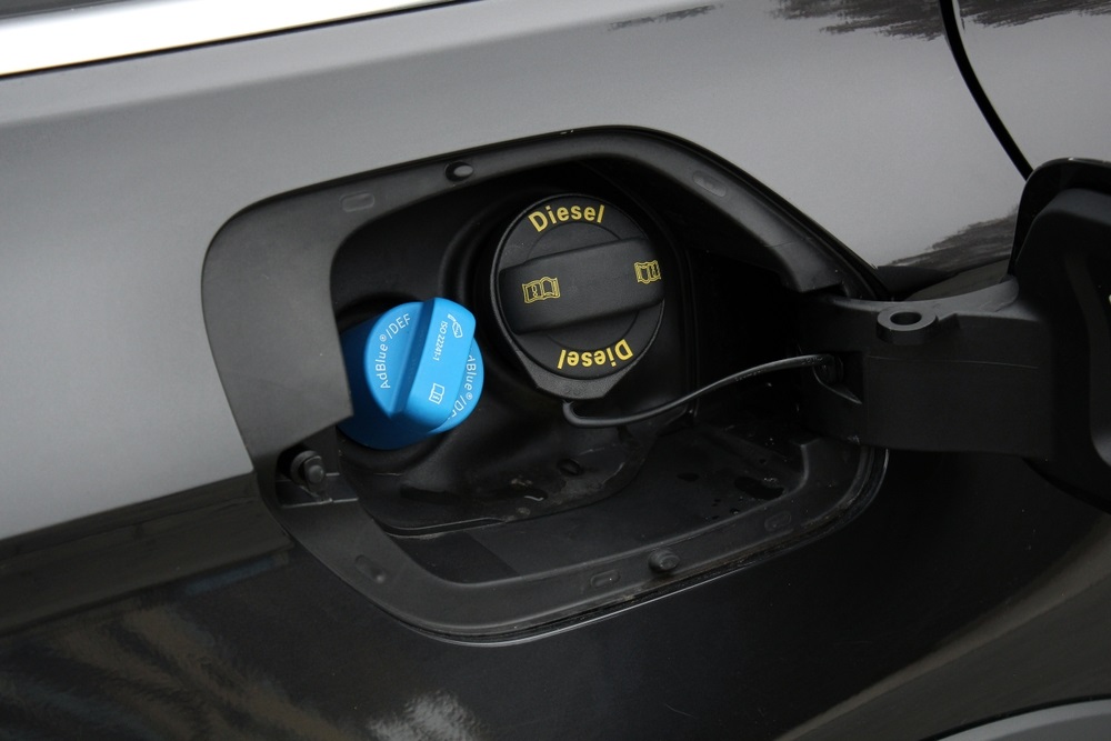 Mercedes BlueTEC diesel vehicle being refueled with AdBlue DEF fluid.