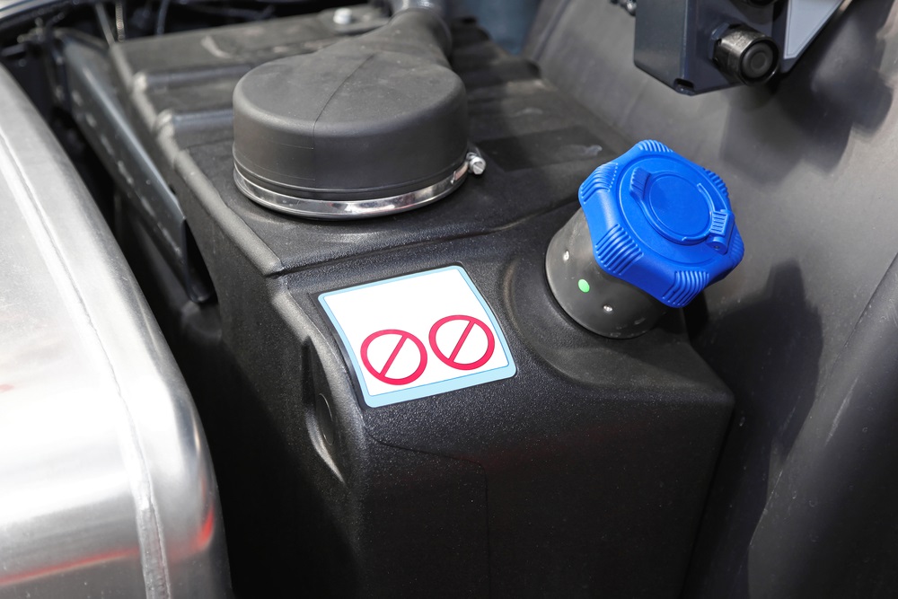 Diesel fuel tank with DEF label and filling nozzle