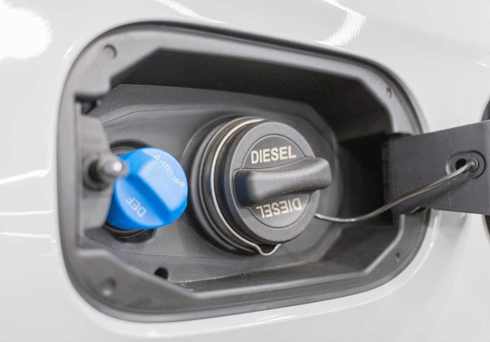 Diesel truck being refilled with diesel exhaust fluid (DEF)